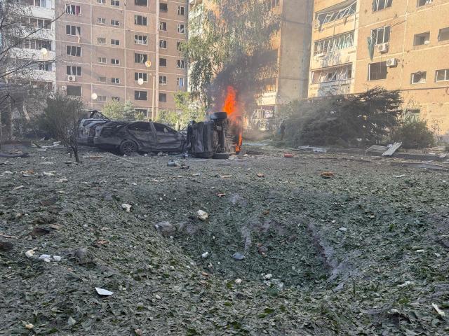 This photograph shows burning cars at the site of a Russian airstrike in Zaporizhzhia on August 2, 2026, amid the Russian invasion of Ukraine. (Photo by Darya NAZAROVA / AFP)