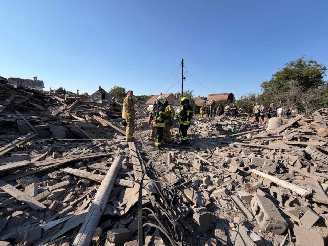 Ukrainian rescuers work amid rubble at the site of a Russian airstrike in Zaporizhzhia on August 2, 2026, amid the Russian invasion of Ukraine. (Photo by Darya NAZAROVA / AFP)