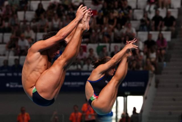 Italy's diver Matteo Santoro and Italy's diver Chiara Pellacani compete in the mixed 3m synchro diving final event during the LEN European Aquatics Championships, at the Olympic Aquatics Centre in Saint-Denis, northeastern suburbs of Paris, on August 2, 2026. (Photo by Dimitar DILKOFF / AFP)