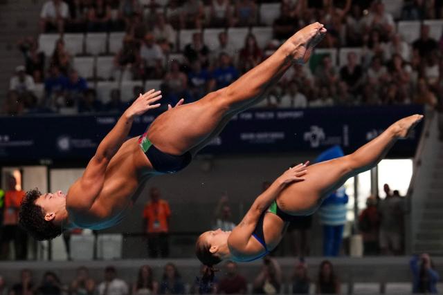 Italy's diver Matteo Santoro and Italy's diver Chiara Pellacani compete in the mixed 3m synchro diving final event during the LEN European Aquatics Championships, at the Olympic Aquatics Centre in Saint-Denis, northeastern suburbs of Paris, on August 2, 2026. (Photo by Dimitar DILKOFF / AFP)