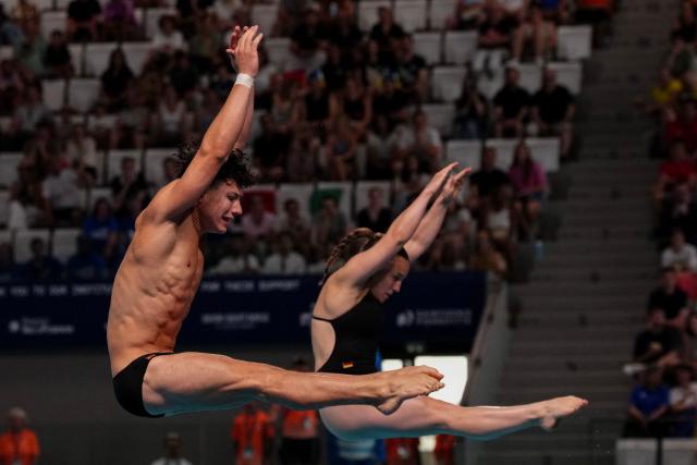 Germany's diver Luis Carlo Avila Sanchez and Germany's diver Lena Corona Hentschel compete in the mixed 3m synchro diving final event during the LEN European Aquatics Championships, at the Olympic Aquatics Centre in Saint-Denis, northeastern suburbs of Paris, on August 2, 2026. (Photo by Dimitar DILKOFF / AFP)