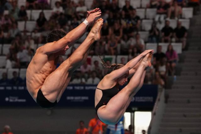 Germany's diver Luis Carlo Avila Sanchez and Germany's diver Lena Corona Hentschel compete in the mixed 3m synchro diving final event during the LEN European Aquatics Championships, at the Olympic Aquatics Centre in Saint-Denis, northeastern suburbs of Paris, on August 2, 2026. (Photo by Dimitar DILKOFF / AFP)
