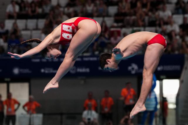 Georgia's diver Koka Sakandelidze and Georgia's diver Tekle Sharia compete in the mixed 3m synchro diving final event during the LEN European Aquatics Championships, at the Olympic Aquatics Centre in Saint-Denis, northeastern suburbs of Paris, on August 2, 2026. (Photo by Dimitar DILKOFF / AFP)