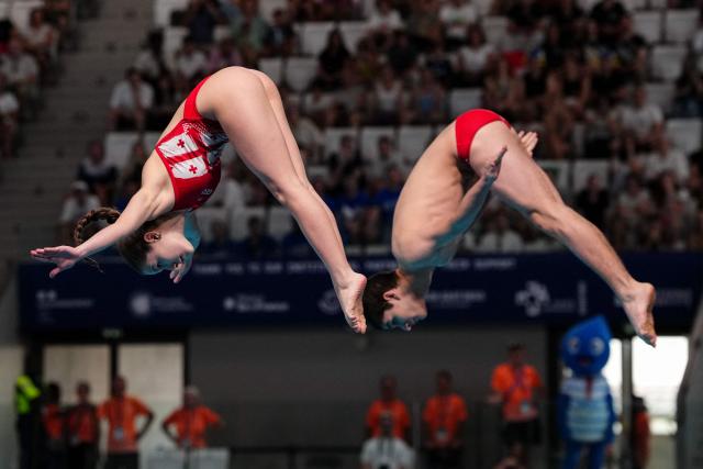 Georgia's diver Koka Sakandelidze and Georgia's diver Tekle Sharia compete in the mixed 3m synchro diving final event during the LEN European Aquatics Championships, at the Olympic Aquatics Centre in Saint-Denis, northeastern suburbs of Paris, on August 2, 2026. (Photo by Dimitar DILKOFF / AFP)