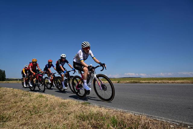 Riders in a breakaway including Laboral Kutxa-Fundacion Euskadi's Ukrainian rider Yuliia Biriukova (R),  VolkerWessels Cycling Team's Dutch rider Eline Jansen (2nd R) and Human Powered Health's Italian rider Carlotta Cipressi (3rd R) compete during the second (out of 9) stage of the fifth edition of the Women's Tour de France cycling race, 147.9 km from Aigle to Geneva, in Aigle on August 2, 2026. (Photo by Nicolas TUCAT / AFP)