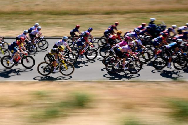 The pack rides during the second (out of 9) stage of the fifth edition of the Women's Tour de France cycling race, 147.9 km from Aigle to Geneva, on August 2, 2026. (Photo by Nicolas TUCAT / AFP)