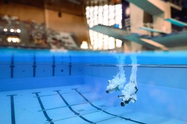 Netherlands' divers Oona Abbema and Matthew Jordon Hibbert compete in the mixed 3m synchro diving final event during the LEN European Aquatics Championships, at the Olympic Aquatics Centre in Saint-Denis, northeastern suburbs of Paris, on August 2, 2026. (Photo by SEBASTIEN BOZON / AFP)