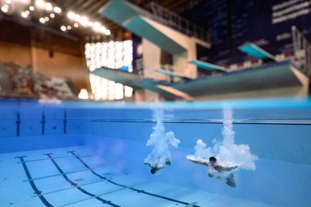Italy's divers Matteo Santoro and Chiara Pellacani compete in the mixed 3m synchro diving final event during the LEN European Aquatics Championships, at the Olympic Aquatics Centre in Saint-Denis, northeastern suburbs of Paris, on August 2, 2026. (Photo by SEBASTIEN BOZON / AFP)