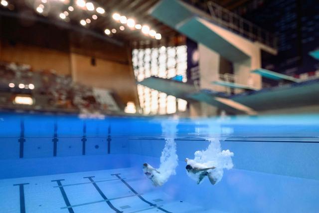 Sweden's divers Peder Saur Hubred and Hanna Ekdahl compete in the mixed 3m synchro diving final event during the LEN European Aquatics Championships, at the Olympic Aquatics Centre in Saint-Denis, northeastern suburbs of Paris, on August 2, 2026. (Photo by SEBASTIEN BOZON / AFP)