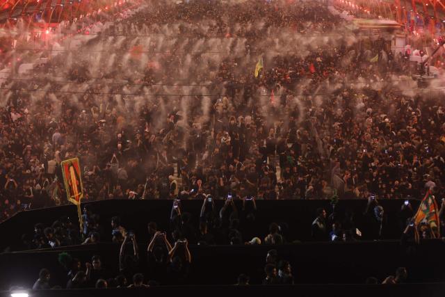 Shia Muslim pilgrims gather near the Imam al-Abbas Shrine in the holy city of Karbala, south of Baghdad on August 2, 2026, at the end of the Arbaeen pilgrimage, which commemorates 40 days of mourning after the martyrdom in the Battle of Karbala in 680 CE of Imam Hussein, the grandson of the Prophet Muhammad. The Arbaeen marks one of the most significant events in the Shia Muslim calendar, during which pilgrims, many from Iran, flock to Iraq to visit the holy shrines. (Photo by AHMAD AL-RUBAYE / AFP)