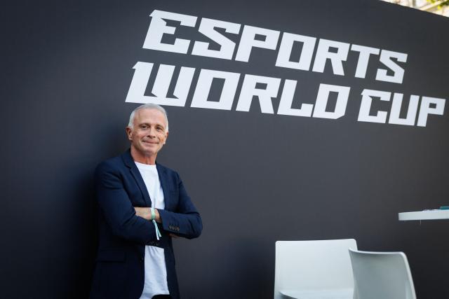 French journalist, radio, TV host and streamer Samuel Etienne poses during an event for the Esports World Cup on the Champs Elysee avenue on August 2, 2026. (Photo by Simon WOHLFAHRT / AFP)