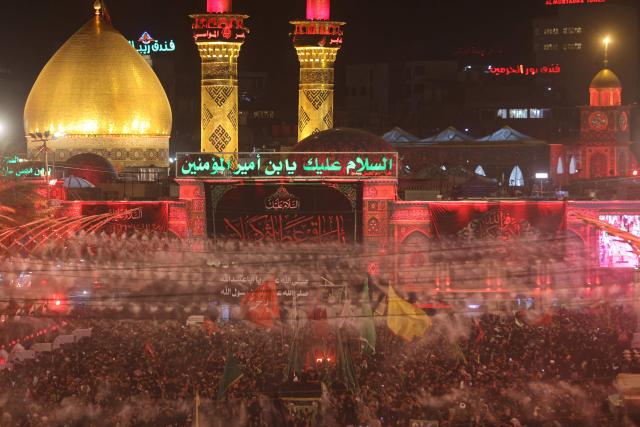 Shia Muslim pilgrims gather near the Imam al-Abbas Shrine in the holy city of Karbala, south of Baghdad on August 2, 2026, at the end of the Arbaeen pilgrimage, which commemorates 40 days of mourning after the martyrdom in the Battle of Karbala in 680 CE of Imam Hussein, the grandson of the Prophet Muhammad. The Arbaeen marks one of the most significant events in the Shia Muslim calendar, during which pilgrims, many from Iran, flock to Iraq to visit the holy shrines. (Photo by Ahmad AL-RUBAYE / AFP)