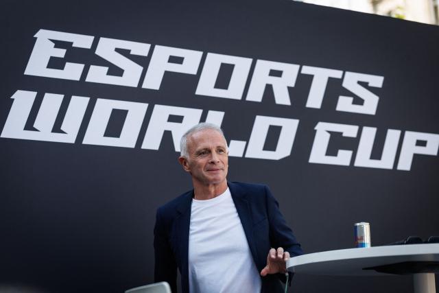 French journalist, radio, TV host and streamer Samuel Etienne looks on during an event for the Esports World Cup on the Champs Elysee avenue on August 2, 2026. (Photo by Simon WOHLFAHRT / AFP)