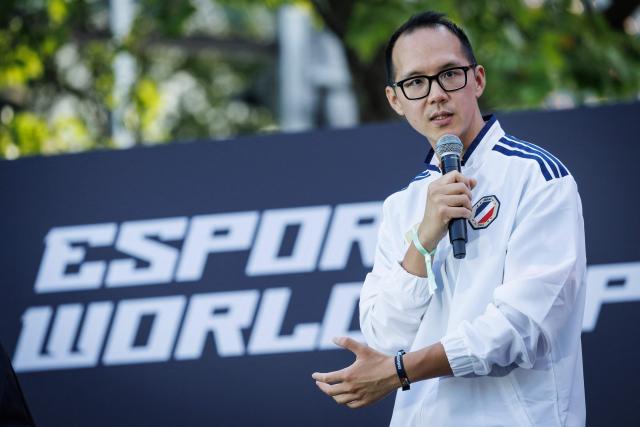 "Yellowstar" head coach of the French national e-sports team Bora Kim speaks during an event for the Esports World Cup on the Champs Elysee avenue on August 2, 2026. (Photo by Simon WOHLFAHRT / AFP)