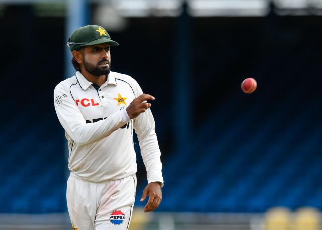 Babar Azam of Pakistan receives the ball during the first day of the second Test match between West Indies and Pakistan at Queen's Park Oval in Port of Spain, Trinidad and Tobago, on August 2, 2026. (Photo by Randy Brooks / AFP)