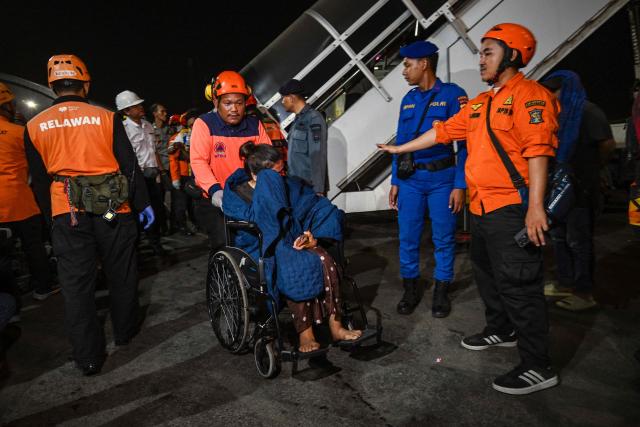 Survivors of the Mutiara Sentosa 2 ferry which caught fire in the waters off Madura island, East Java, on August 2, 2026, disembark at Tanjung Perak port in Surabaya early on August 3, 2026. An Indonesian ferry caught fire at sea on Sunday, killing five people and leaving another 41 missing after some jumped overboard, search and rescue officials said. A total of 225 people on the vessel were rescued, said the regional Surabaya Search and Rescue Agency, which provided the latest figures in an afternoon update. (Photo by JUNI KRISWANTO / AFP)