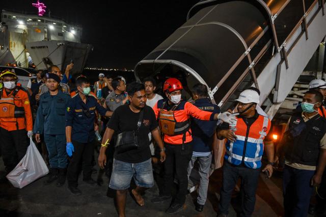 Survivors of the Mutiara Sentosa 2 ferry which caught fire in the waters off Madura island, East Java, on August 2, 2026, disembark at Tanjung Perak port in Surabaya early on August 3, 2026. An Indonesian ferry caught fire at sea on Sunday, killing five people and leaving another 41 missing after some jumped overboard, search and rescue officials said. A total of 225 people on the vessel were rescued, said the regional Surabaya Search and Rescue Agency, which provided the latest figures in an afternoon update. (Photo by JUNI KRISWANTO / AFP)