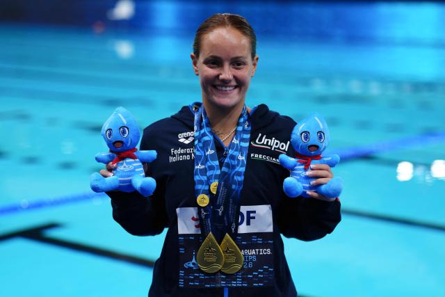 Gold medallist Italy's diver Chiara Pellacani celebrates on the podium after the women’s 1m springboard diving final event during the LEN European Aquatics Championships, at the Olympic Aquatics Centre in Saint-Denis, northeastern suburbs of Paris, on August 2, 2026. (Photo by Dimitar DILKOFF / AFP)