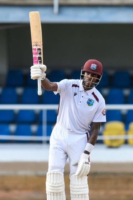 Justin Greaves of West Indies celebrates his half century during the first day of the second Test match between West Indies and Pakistan at Queen's Park Oval in Port of Spain, Trinidad and Tobago, on August 2, 2026. (Photo by Randy Brooks / AFP)