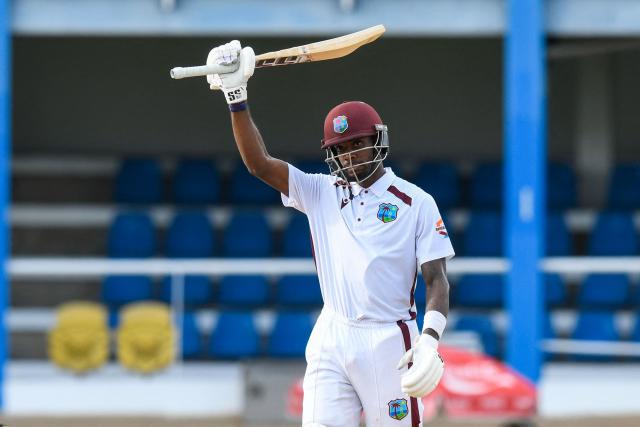 Justin Greaves of West Indies celebrates his half century during the first day of the second Test match between West Indies and Pakistan at Queen's Park Oval in Port of Spain, Trinidad and Tobago, on August 2, 2026. (Photo by Randy Brooks / AFP)