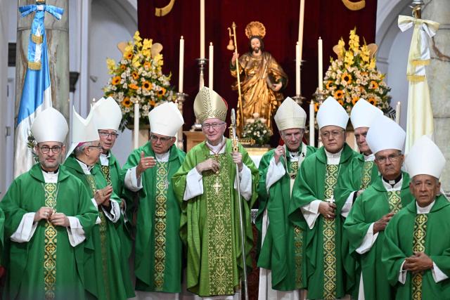 The Vatican's Secretary of State Cardinal Pietro Parolin (C), poses for a picture with Guatemalan bishops after a mass at the Metropolitan Cathedral in Guatemala City on August 2, 2026, during his official visit to the country. (Photo by Johan ORDONEZ / AFP)