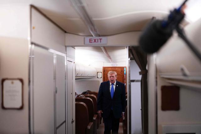 US President Donald Trump speaks to the press aboard Air Force One on August 2, 2026. Trump is returning to the White House after spending the weekend in New Jersey at his Bedminster residence. (Photo by Aaron Schwartz / AFP)