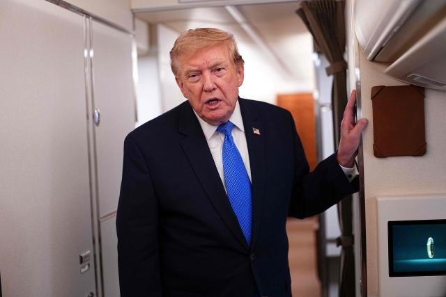 US President Donald Trump speaks to the press aboard Air Force One on August 2, 2026. Trump is returning to the White House after spending the weekend in New Jersey at his Bedminster residence. (Photo by Aaron Schwartz / AFP)