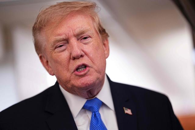 US President Donald Trump speaks to the press aboard Air Force One on August 2, 2026. Trump is returning to the White House after spending the weekend in New Jersey at his Bedminster residence. (Photo by Aaron Schwartz / AFP)