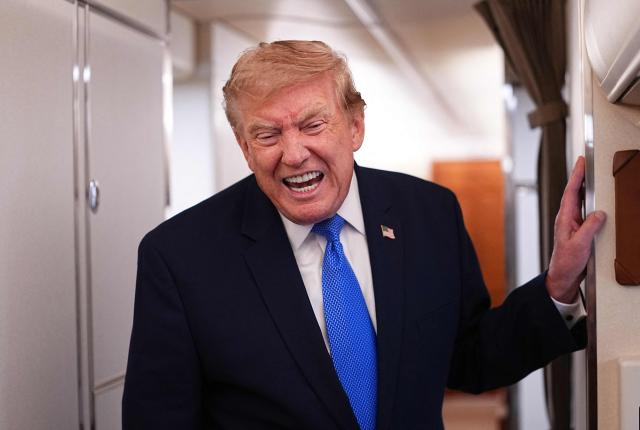 US President Donald Trump speaks to the press aboard Air Force One on August 2, 2026. Trump is returning to the White House after spending the weekend in New Jersey at his Bedminster residence. (Photo by Aaron Schwartz / AFP)