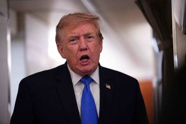 US President Donald Trump speaks to the press aboard Air Force One on August 2, 2026. Trump is returning to the White House after spending the weekend in New Jersey at his Bedminster residence. (Photo by Aaron Schwartz / AFP)