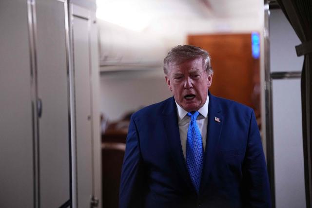 US President Donald Trump speaks to the press aboard Air Force One on August 2, 2026. Trump is returning to the White House after spending the weekend in New Jersey at his Bedminster residence. (Photo by Aaron Schwartz / AFP)