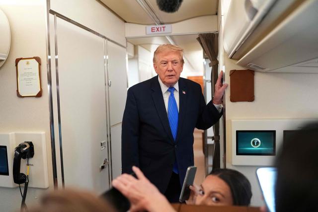 US President Donald Trump speaks to the press aboard Air Force One on August 2, 2026. Trump is returning to the White House after spending the weekend in New Jersey at his Bedminster residence. (Photo by Aaron Schwartz / AFP)