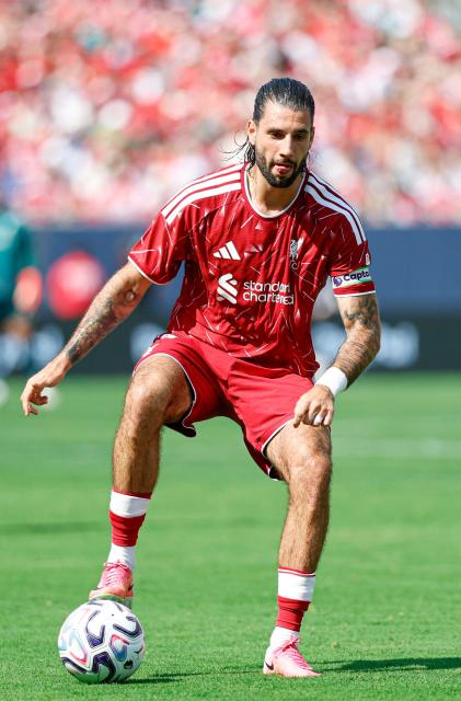 Liverpool's midfielder #08 Dominik Szoboszlai controls the ball during the first half of the pre-season friendly football match between Liverpool FC and Leeds United FC at Soldier Field in Chicago, Illinois, on August 2 2026. , (Photo by KAMIL KRZACZYNSKI / AFP)