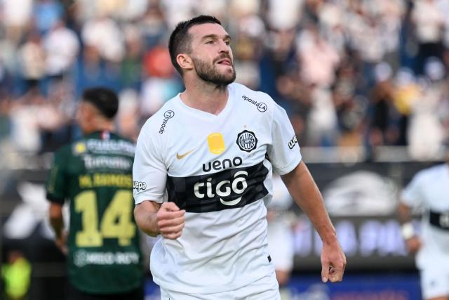 Olimpia's New Zealander player Tim Payne celebrates after scoring on his debut in the Paraguayan league during the Clausura tournament football match between Olimpia and Rubio Nu, at the Defensores del Chaco stadium in Asuncion, on August 2, 2026. (Photo by AFP)