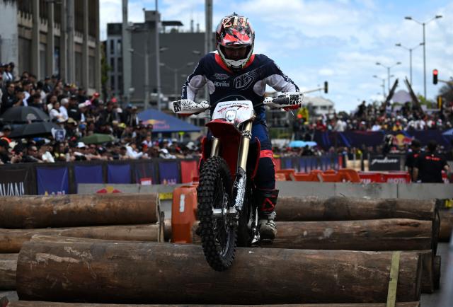 Colombian rider Daniel Palacio competes during the first enduro race held through the streets of the city at the Red Bull Moto Urbano event in Bogota on August 2, 2026. (Photo by Raul ARBOLEDA / AFP)