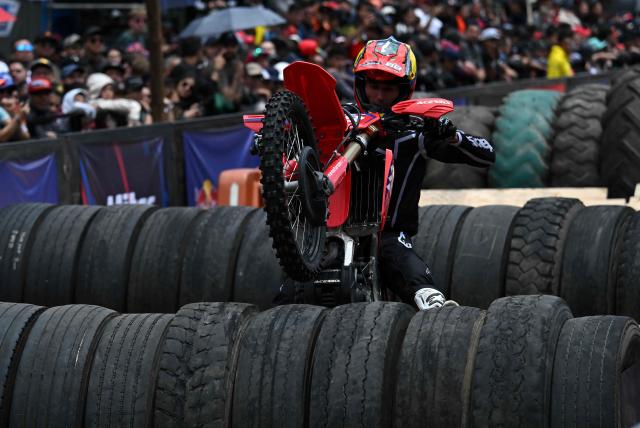Colombian rider Pablo Ancizar competes during the first enduro race held through the streets of the city at the Red Bull Moto Urbano event in Bogota on August 2, 2026. (Photo by Raul ARBOLEDA / AFP)