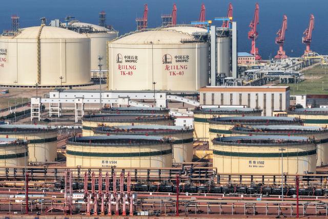 Tanks are seen at a Sinopec Company oil and LNG storage and transportation base in Longkou, Shandong province, eastern China, on August 2, 2026. (Photo by CN-STR / AFP) / China OUT