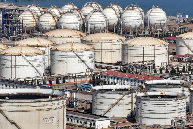 Tanks are seen at a Sinopec Company oil and LNG storage and transportation base in Longkou, Shandong province, eastern China, on August 2, 2026. (Photo by CN-STR / AFP) / China OUT