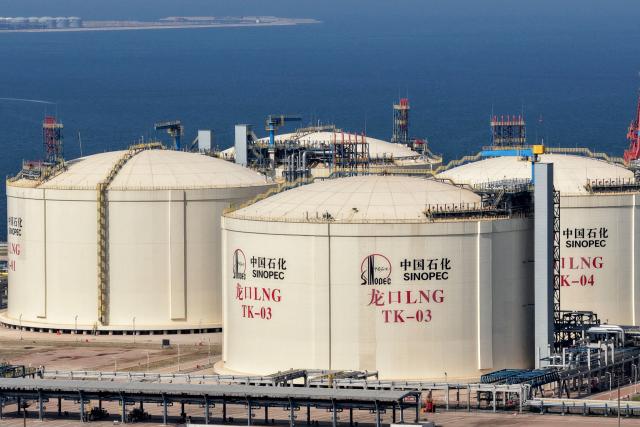 Tanks are seen at a Sinopec Company oil and LNG storage and transportation base in Longkou, Shandong province, eastern China, on August 2, 2026. (Photo by CN-STR / AFP) / China OUT