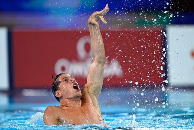 Bulgaria's artistic swimmer Dimitar Isaev competes in the men’s solo free artistic swimming final event during the LEN European Aquatics Championships, at the Olympic Aquatics Centre in Saint-Denis, northeastern suburbs of Paris, on August 3, 2026. (Photo by JULIEN DE ROSA / AFP)