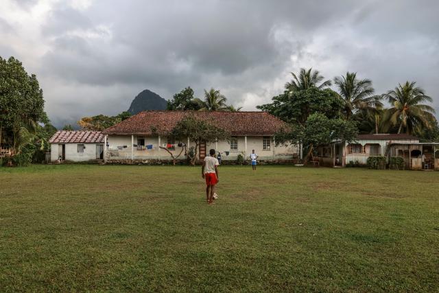 Residents play football in Monte Alegre, near Santo Antonio, in Príncipe Island in São Tomé and Príncipe, on August 2, 2026. Situated in the northwestern part of Príncipe Island, Monte Alegre (also known as Montalegre) is a historic former plantation (roça) and natural landmark featuring a scenic hiking trail and waterfall located in the northwest of Príncipe Island. (Photo by Daniel BELOUMOU OLOMO / AFP)