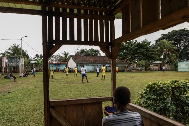 Residents play football in Monte Alegre, near Santo Antonio, in Príncipe Island in São Tomé and Príncipe, on August 2, 2026. Situated in the northwestern part of Príncipe Island, Monte Alegre (also known as Montalegre) is a historic former plantation (roça) and natural landmark featuring a scenic hiking trail and waterfall located in the northwest of Príncipe Island. (Photo by Daniel BELOUMOU OLOMO / AFP)