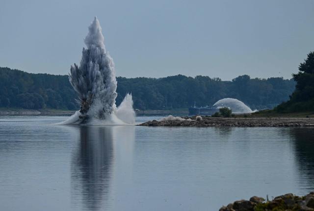 A controlled underwater explosion is pictured on the riverbed of the Danube River in Izvoarele village, on August 3, 2026. The blast aimed at deepening the channel and diverting a higher volume of water toward the cooling systems of the Cernavoda Nuclear Power Plant. Local authorities and plant engineers authorized the blasting operations to counteract critically low water levels caused by a prolonged summer heatwave, ensuring the continuous and safe operation of the facility's reactors. (Photo by Daniel MIHAILESCU / AFP)