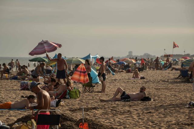 Holidaymakers enjoy Serignan Beach on France's southern Mediterranean coast on August 2, 2026. (Photo by Ed JONES / AFP)
