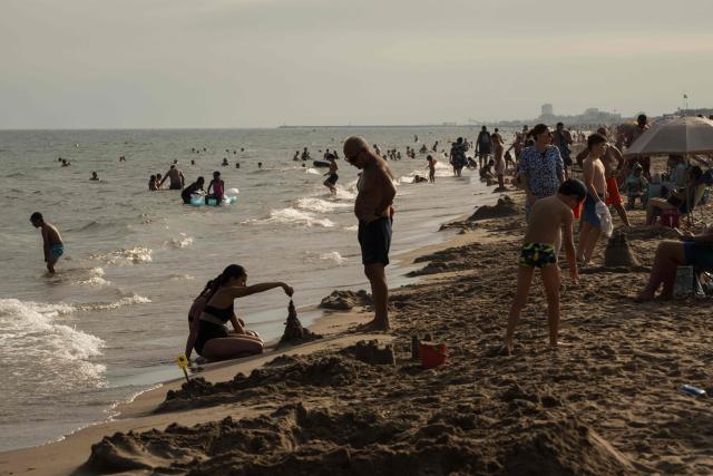 Holidaymakers enjoy Serignan Beach on France's southern Mediterranean coast on August 2, 2026. (Photo by Ed JONES / AFP)