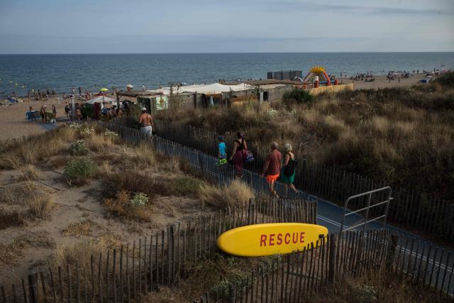 Holidaymakers enjoy Serignan Beach on France's southern Mediterranean coast on August 2, 2026. (Photo by Ed JONES / AFP)