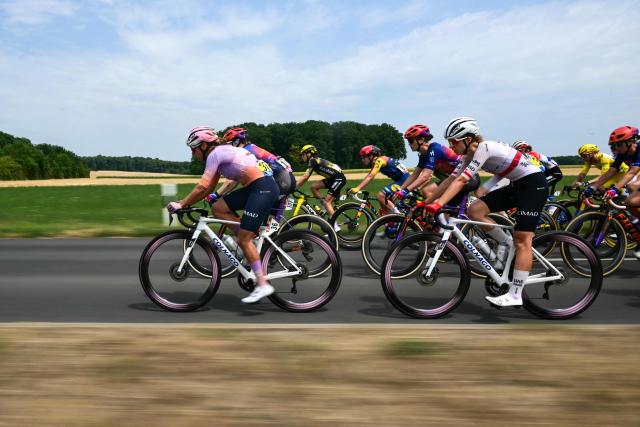 The pack rides near Geneve during the 3rd (out of 9) stage of the fifth edition of the Women's Tour de France cycling race, 156.5 km from Geneva to Poligny, in Poligny, central-eastern France on August 3, 2026. (Photo by NICOLAS TUCAT / AFP)