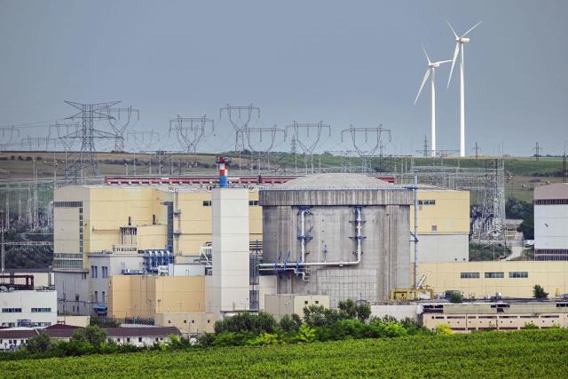 The Cernavoda nuclear plant's reactor 1 building is seen next to the Danube-Black Sea navigation channel in Cernavoda, Romania  on August 3, 2026. Romanian army forces detonate an explosive load into the rock bed of Danube in Izvoarele village - upstream from Cernavoda- to help diverting a higher volume of water toward the cooling systems of the Cernavod? Nuclear Power Plant. Local authorities and plant engineers authorized the blasting operations to counteract critically low water levels caused by a prolonged summer heatwave, ensuring the continuous and safe operation of the facility's reactors. (Photo by Daniel MIHAILESCU / AFP)