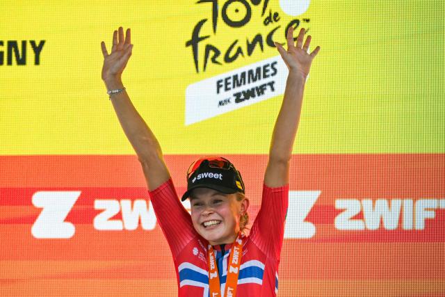 Uno-X Mobility's Norwegian rider Sigrid Ytterhus Haugset celebrates on the podium after winning the 3rd (out of 9) stage of the fifth edition of the Women's Tour de France cycling race, 156.5 km from Geneva to Poligny, in Poligny, central-eastern France on August 3, 2026. (Photo by NICOLAS TUCAT / AFP)