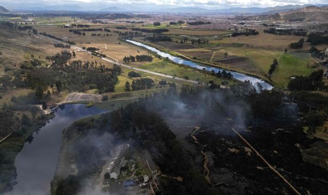 Aerial view showing a wildfire amid high temperatures in Sibate, near Bogota, Colombia, on August 3, 2026. (Photo by Raul ARBOLEDA / AFP)
